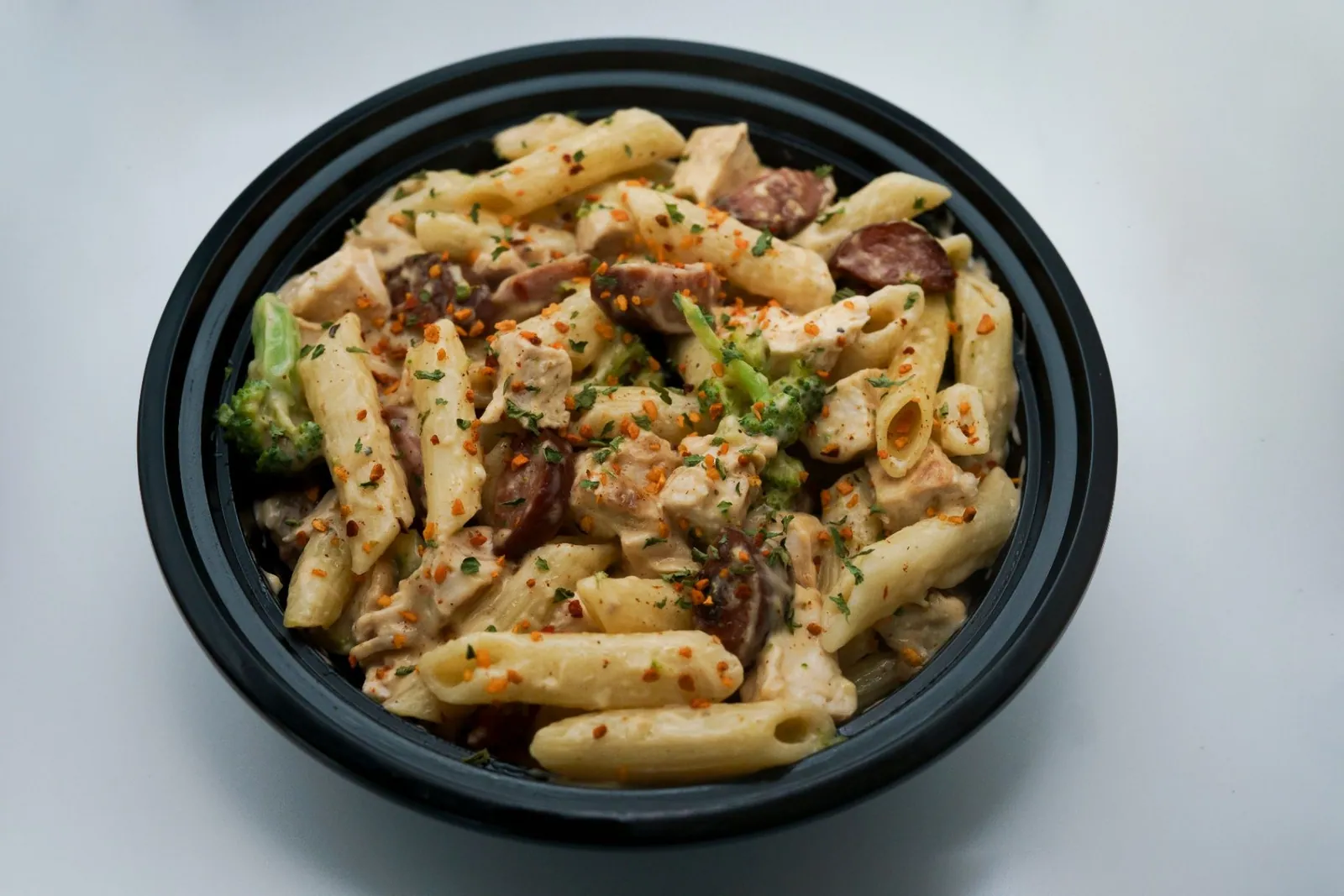 Creamy chicken pasta prepared as a ready-to-heat meal